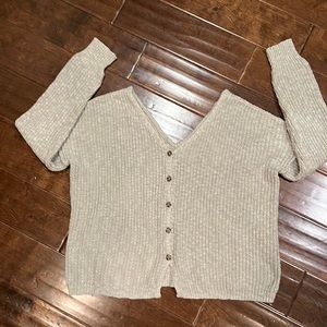 V neck and V back sweater. Nice loose fit. Should fit medium.
